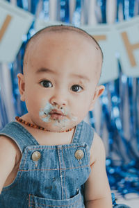 Close-up portrait of cute girl looking away