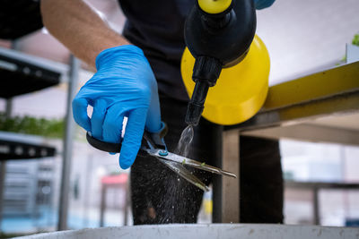 Low section of man working in factory