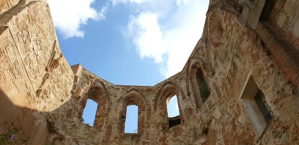 Low angle view of old building against sky