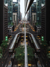 High angle view of traffic on road amidst buildings in city