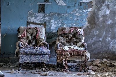 Damaged chairs in abandoned room