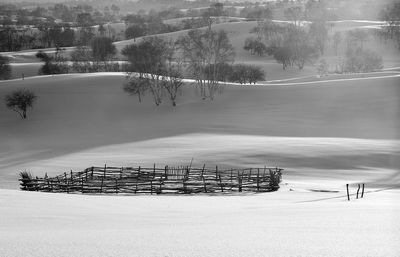 Scenic view of snow covered landscape against sky