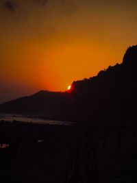 Scenic view of silhouette mountains against sky during sunset