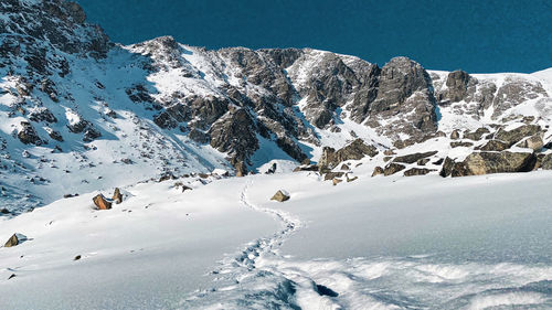 Snow covered mountain against sky