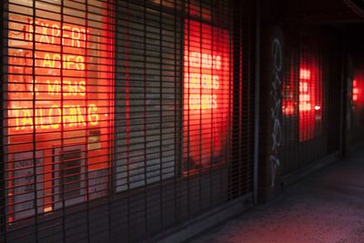 Illuminated neon light text in window