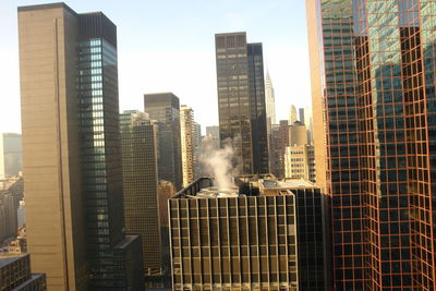 Low angle view of buildings against sky in city