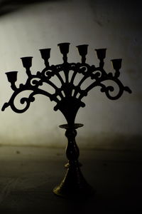 Close-up of electric lamp on table