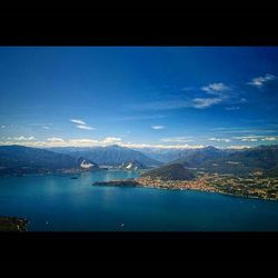 Scenic view of lake against cloudy sky