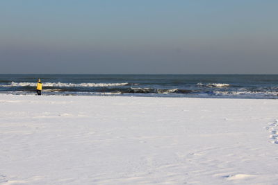 Scenic view of sea against clear sky during winter