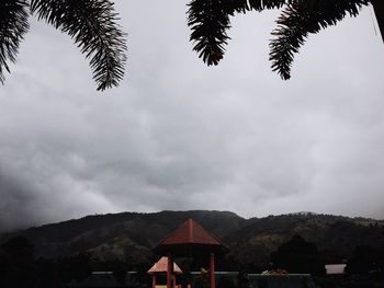 Built structure on landscape against sky