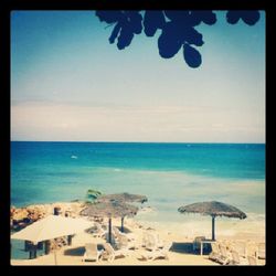 Scenic view of sea against blue sky