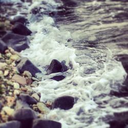 Close-up of water splashing on rocks