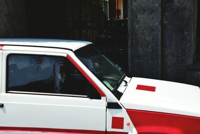 Close-up of red car on road