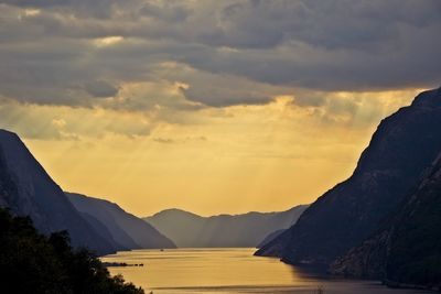 Scenic view of lake against sky during sunset