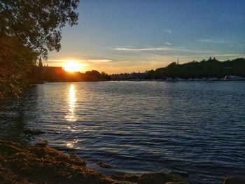 View of calm lake at sunset