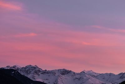 Scenic view of snowcapped mountains against sky during sunset