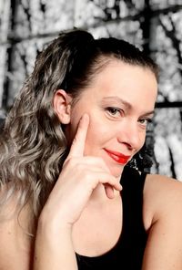 Close-up portrait of a smiling young woman