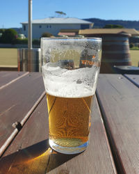 Close-up of beer glass on table