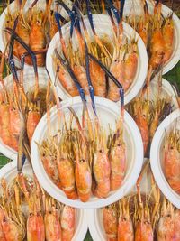 High angle view of shellfish on plates in bangkok 