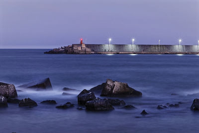 Scenic view of sea against sky at dusk