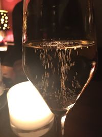 Close-up of wine glasses on table