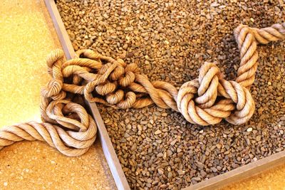 High angle view of rope tied up on metal