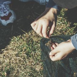 Cropped image of man holding hands