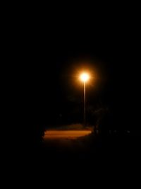 Illuminated street light at night