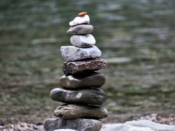 Close-up of stack of pebbles on rock