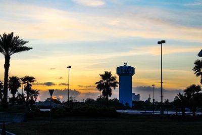 Silhouette tower against sky during sunset