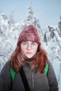 Portrait of woman wearing knit hat during winter