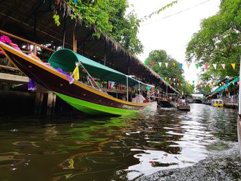 View of boats in canal along buildings