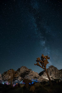 Scenic view of mountains against sky at night