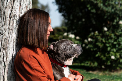 Side view of woman with dog