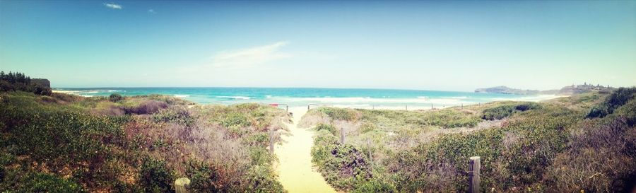 Scenic view of sea against blue sky