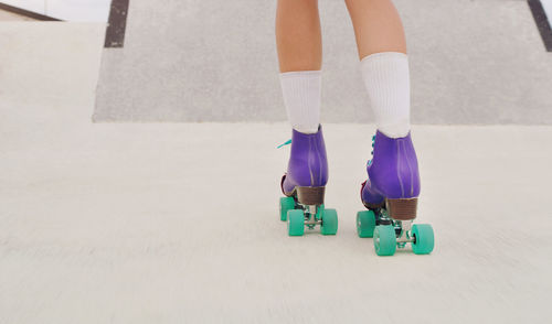 Legs of a woman rollerskating.