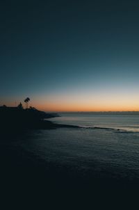 Scenic view of sea against sky at sunset