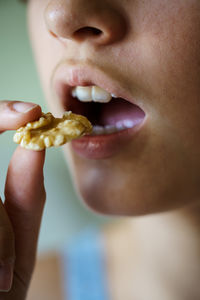 Close-up of woman eating food