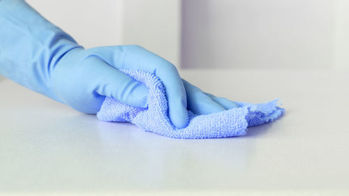 Cropped hand of person wearing socks