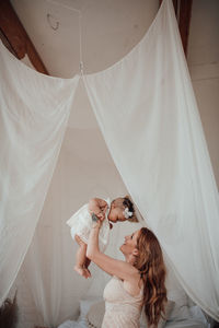 Woman holding white umbrella