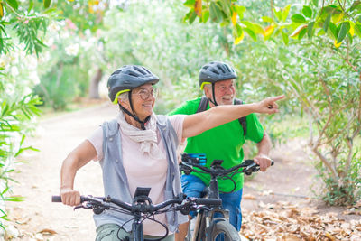 Young woman riding bicycle on field