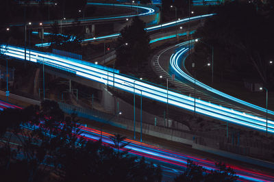 High angle view of light trails on road at night