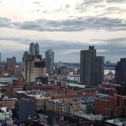 High angle view of buildings in city against sky