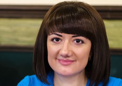 Close-up portrait of smiling young woman