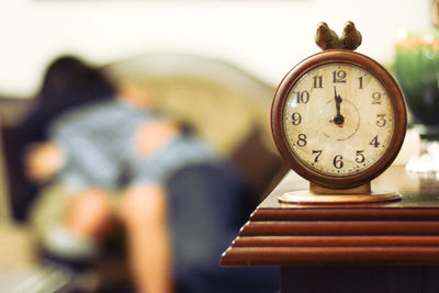 Close-up of clock on table