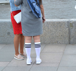 Low section of women standing outdoors