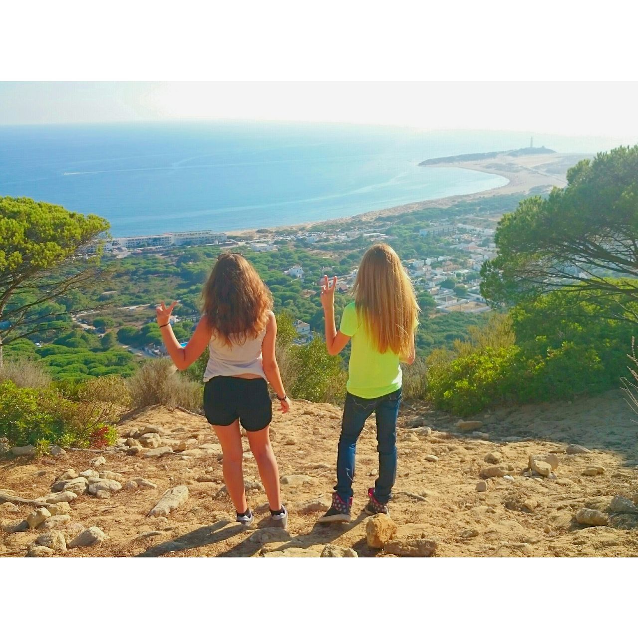 lifestyles, rear view, leisure activity, full length, sea, water, transfer print, horizon over water, childhood, standing, girls, togetherness, casual clothing, beach, sky, boys, person, auto post production filter