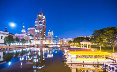 Illuminated buildings in city at night