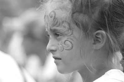 Close-up portrait of a girl looking away
