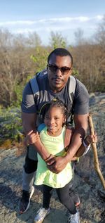 Full length of father and daughter outdoors